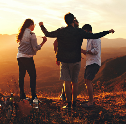 Youth looking out over valley on a sunny afternoon